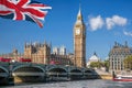 Big Ben and Houses of Parliament with red buses on bridge in London, England, UK Royalty Free Stock Photo