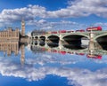 Big Ben and Houses of Parliament with red buses on the bridge in London, England, UK Royalty Free Stock Photo