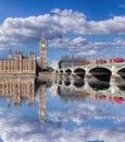 Big Ben and Houses of Parliament with red buses on the bridge in London, England, UK Royalty Free Stock Photo