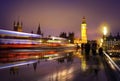 Big Ben and houses of Parliament at sunset and traffic lights. Royalty Free Stock Photo