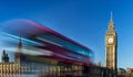 Big Ben and passing red bus in London, United Kingdom Royalty Free Stock Photo