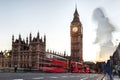 Big Ben with red buses on the bridge in the evening, London, England, United Kingdom