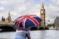 Big Ben and tourist with British flag umbrella in London Royalty Free Stock Photo