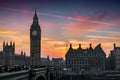 The Big Ben tower and Westminster Bridge at the river Thames in London during sunset time