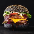 Big black burger grilled with double meat cutlet on a black background.