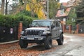 Big black high 4x4 offroad car Jeep Wrangler Sahara five door parked Royalty Free Stock Photo