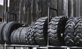 Big black huge big truck, tractor or bulldozer loader tires wheel close-up on stand, shop selling tyres for farming and big vehicl Royalty Free Stock Photo