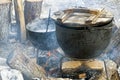 Black kettle for campfire on tripod Royalty Free Stock Photo