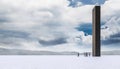 Big black monolith in the desert and group of people waiting