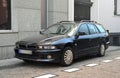 Big black old veteran car Mitsubishi Galant eighth generation hatchback parked