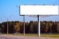Big blank billboard mock-up along highway against  forest Royalty Free Stock Photo