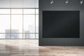 Big blank black illuminated billboard with space for your advertisement on dark wall in sunlit empty hall with wooden floor and