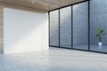 Big blank white partition with place for your logo or advertising text on concrete floor in empty abstract hall with wooden