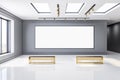 Big blank white poster in black frame on grey wall in sunny empty exhibition area with windows in the ceiling and golden benches Royalty Free Stock Photo