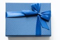 big blue gift box with a blue bow on a white background Royalty Free Stock Photo