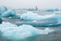 Big Blue Icebergs in Jokulsarlon Glacier Lagoon. Glacial Drift at Calm Water. Pure Ice Chunks from Melting Glacier. Icy Royalty Free Stock Photo