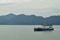 Big Blue Passenger Ferry Boat goes on the sea near Trad Island Royalty Free Stock Photo