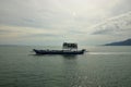 Big Blue Passenger Ferry Boat goes on the sea near Trad Island Royalty Free Stock Photo