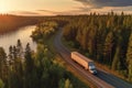 Big blue truck driving fast with a white trailer with blank space for text on a countryside road with other cars against