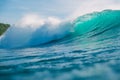 Big blue wave for surfing in ocean. Breaking turquoise wave in Bali, Uluwatu