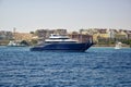 Big blue yacht on pier waiting for tourists for sea trip. Vacation on Red Sea, resort, holidays, leisure and adventure, travel.