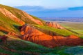 Big Bogdo mountain. Red sandstone outcrops on the slopes sacred mountain in Caspian steppe Bogdo - Baskunchak nature reserve,