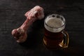 Big bone and beer on a table Royalty Free Stock Photo