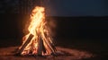 A big bonfire glowing intensely against the dark night sky Royalty Free Stock Photo