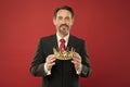 He is a big boss here. The old man or big boss. Proud boss. Big boss holding jewelry crown on red background. Mature Royalty Free Stock Photo