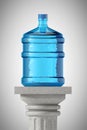 Big bottle of water over Stone Classic Greek Column Royalty Free Stock Photo