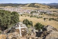 Big Boulders with a painted cross and a view over Almaden de la Plata town