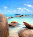 Big boulders at the tropical coastline with turqiouse seawater