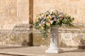 Big bouquets of colorful flowers. Luxury wedding floral decorations at the entrance of Ostuni church. Royalty Free Stock Photo
