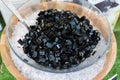 Big bowl of black grass jelly with ice on summer dessert