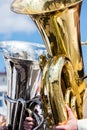 Big brass bass tubas against blue sky background Royalty Free Stock Photo