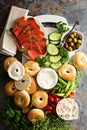Big breakfast platter with bagels, smoked salmon and vegetables