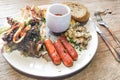 Big breakfast of sausage, mushroom, baked beans, salad wholemeal Royalty Free Stock Photo