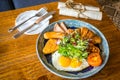 Big breakfast set with chicken ham, jumbo beef sausage, croissant, hashbrown, sunny side up egg, grilled tomato Royalty Free Stock Photo