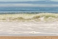 Big breaking Ocean wave on a sandy beach on the north shore of Oahu Hawaii Royalty Free Stock Photo