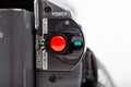 Big bright red round REC record button on digital camcorder camera back control panel, macro closeup video recording switch power Royalty Free Stock Photo