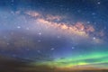 Big bright starry sky night blue milky way universe aurora borealis on dramatic clouds blue green pink lilac colorful cosmic b Royalty Free Stock Photo