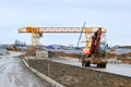 Big bright yellow powerful industrial heavy excavator tractor, bulldozer, specialized construction equipment for road repair Royalty Free Stock Photo