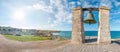 Big bronze bell on the sea shore in the ancient Greek city Chersonesus, Hersones in Sevastopol, Crimea. Copy space. Travel and Royalty Free Stock Photo