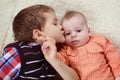 Big brother kissing the baby Royalty Free Stock Photo