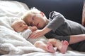 Big Brother Lovingly Playing with Newborn Baby Sister Royalty Free Stock Photo