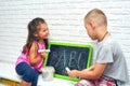 Big Brother Teaches Sister to Write Letters in Summer Holidays