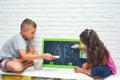 Big Brother Teaches Sister to Write Letters in Summer Holidays
