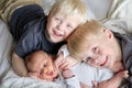 Big Brothers Hugging Newborn Baby Sister Royalty Free Stock Photo
