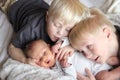 Big Brothers Hugging Newborn Baby Sister Royalty Free Stock Photo