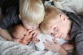 Big Brothers Hugging Newborn Baby Sister Royalty Free Stock Photo
